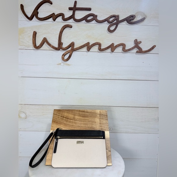kate spade Handbags - Kate Spade Laurel Way Tinnie Wristlet with Zip Closure Cream /Black - EUC